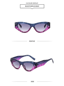 Detail of cat eye sunglasses with blue purple gradient frame and tiger stripes texture