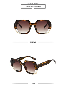 Detail of hawksbill brown geometric sunglasses with gold metal trim and gradient lenses