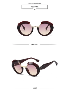 Detail view of burgundy geometric polygon sunglasses with pink gradient lenses and wide temples