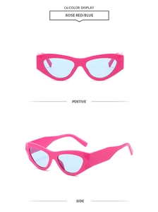 Detail of rose red cat-eye sunglasses with blue lenses and geometric frame design