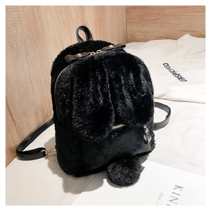 Close-up of black fuzzy bunny ears backpack with plush tail and gold metal zipper