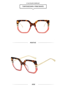 Detail view of tortoiseshell and pink oversized glasses frame with slim gold metal temples
