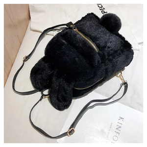 Close-up of black fuzzy faux fur rabbit ear backpack with adjustable leather straps
