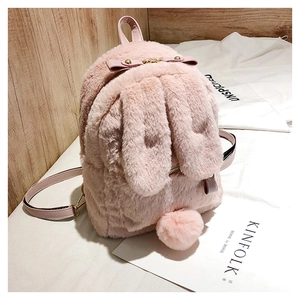 Detail of pink faux fur rabbit backpack featuring 3D long bunny ears and fluffy pom-pom tail