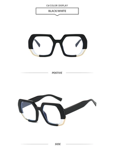 Detail view of bold geometric black and white frames with gold metal accents