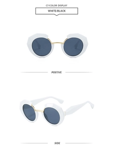 Detailed views of geometric white sunglasses with black lenses and gold bridge