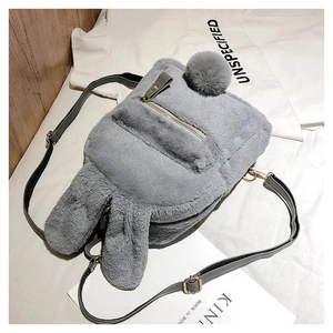 Detail of grey plush bunny backpack with cute long ears and soft faux fur texture