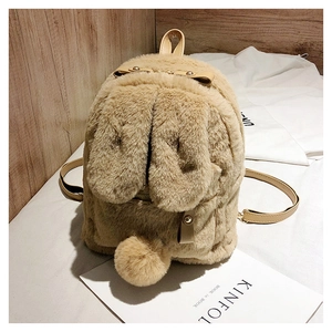Detail of plush bunny backpack with soft faux fur ears and leather bow handle