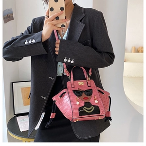 Pink crocodile-embossed handbag featuring a chic female illustration with 3D sunglasses
