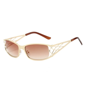 Lunettes de soleil dorées ajourées à cristaux avec verres marron dégradés tendance