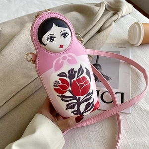 Detailed view of pink Matryoshka doll PU crossbody bag with tulip patterns and gold hardware