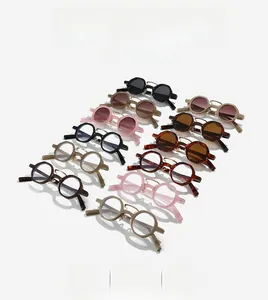 Multiple vintage double-bridge polygon sunglasses displayed in diverse trendy colors