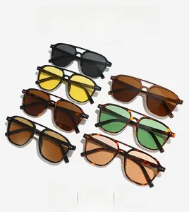 Detailed flat lay of vintage aviator sunglasses in seven different lens and frame colors