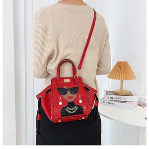 Detail of red crocodile texture bag with fashion lady illustration and pearl earrings