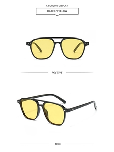 Detail view of retro pilot sunglasses with black frame, yellow lenses and side rivets