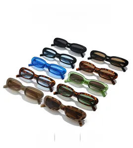 Flat lay of retro oval sunglasses in various colors including tortoiseshell and blue