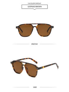 Close-up of leopard print aviator sunglasses with brown lenses and metal rivet details