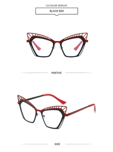 Detail view of cat eye hollow metal frame glasses in stylish black and red finish