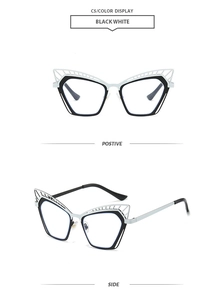 Detail of cat-eye frames with black and white contrast and hollow geometric texture