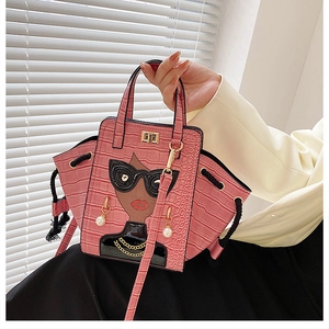 Detailed alligator texture and urban woman portrait with 3D sunglasses on pink handbag