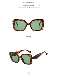 Detail of leopard print square sunglasses featuring green lenses and white rhinestone accents