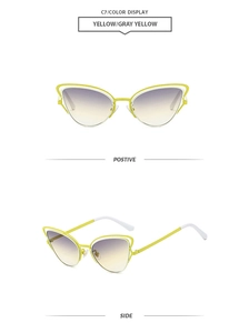 Detail view of cat eye sunglasses with yellow hollow metal frames and gradient lenses