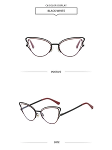 Detail view of stylish dual-frame cat-eye sunglasses with burgundy accents and metal frame