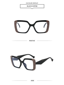 Detailed view of square frame sunglasses with silver rivets and black coffee finish
