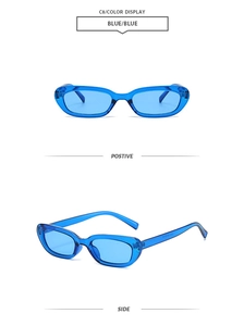 Detail view of small oval retro sunglasses featuring blue transparent frames and blue lenses