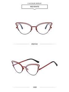 Detail view of red and white cat-eye sunglasses with hollow metal frame structure