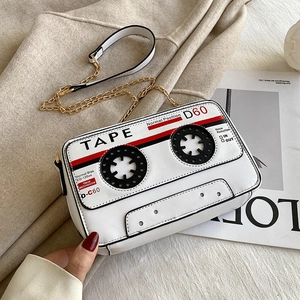 Macro shot of creative retro cassette tape design with printed audio details on white bag