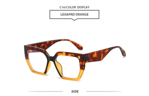 Side view of leopard print and orange gradient oversized square sunglasses with wide temples