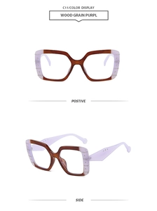 Detail view of square frame sunglasses with wood grain texture and rivet accents