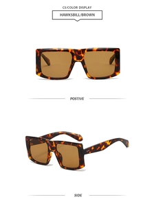 Detail view of stylish square tortoiseshell sunglasses with brown lenses and metal dots