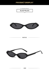 Detailed view of vintage cat eye sunglasses in glossy black frame with dark lenses
