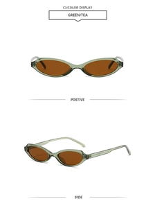 Detail view of vintage oval sunglasses in transparent green frame and tea-colored lenses