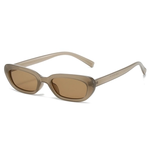 Retro cat-eye sunglasses with translucent brown frames and dark tea lenses in front view