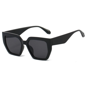 Fashionable oversized polygon black sunglasses with dark lenses from a 45-degree angle view