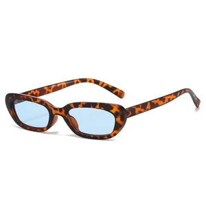 Vintage narrow oval tortoise shell sunglasses with light blue lenses for outdoor style
