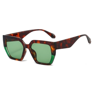 Oversized polygonal sunglasses with tortoise shell frames and green lenses for women