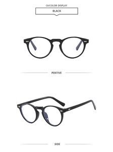 Detail view of round black sunglasses showing silver rivets and blue light lenses