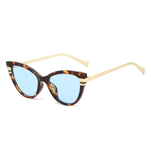 Vintage cat eye sunglasses with tortoise frame, blue lenses and gold metal temples
