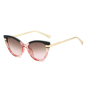 Retro cat-eye sunglasses with black-red frames, gold metal temples and gradient lenses
