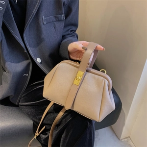 Elegant khaki lychee grain leather shell bag with gold lock and adjustable strap