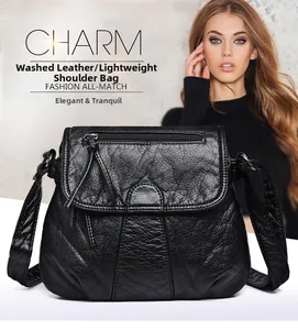 Detail of washed leather shoulder bag showing wrinkled texture and functional zipper