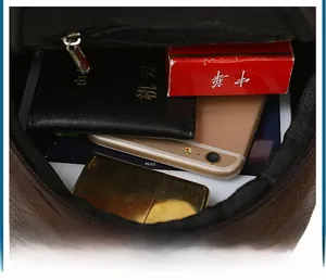 Interior view of brown leather chest bag with large capacity and organized compartments