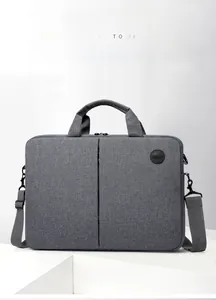Front view of grey business laptop bag with textured fabric, handles and shoulder strap