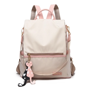 Sac à dos minimaliste en tissu oxford beige avec touches roses et breloque chat