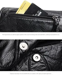 Macro detail of black PU leather bag showing exterior zipper pocket and silver magnetic clasp