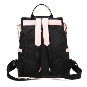 Sac à dos en tissu oxford noir avec détails roses et poche arrière antivol pratique